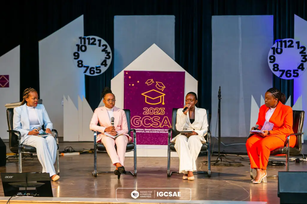 Ladies seated on stage